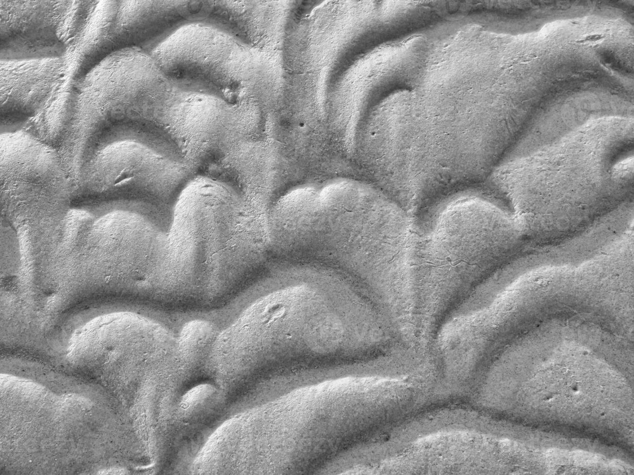 Structure in the sand made by waves. View on the ground at low tide. Nature photo