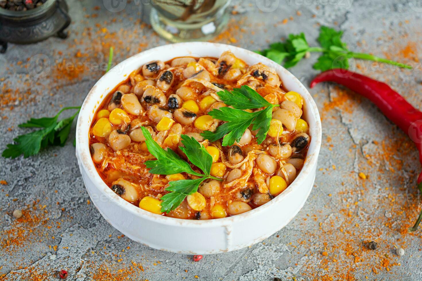 Chili con carne in a bowl. Mexican cuisine. Chili with meat, corn and beans photo