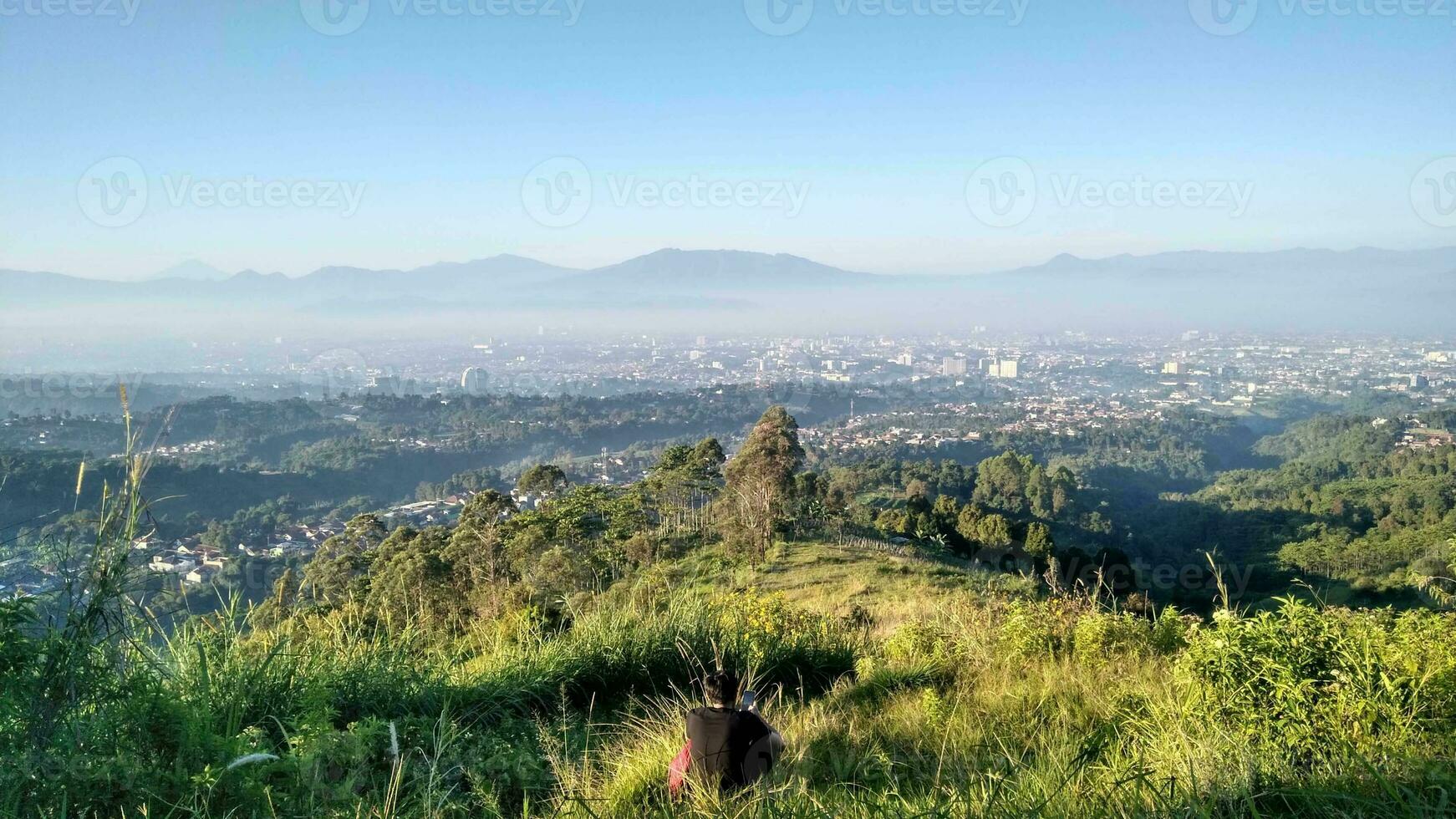 Welcome to Bandung, a city nestled among lush green hills in West Java, Indonesia. Known as the Paris of Java Bandung exudes a unique blend of natural beauty and urban charm. photo