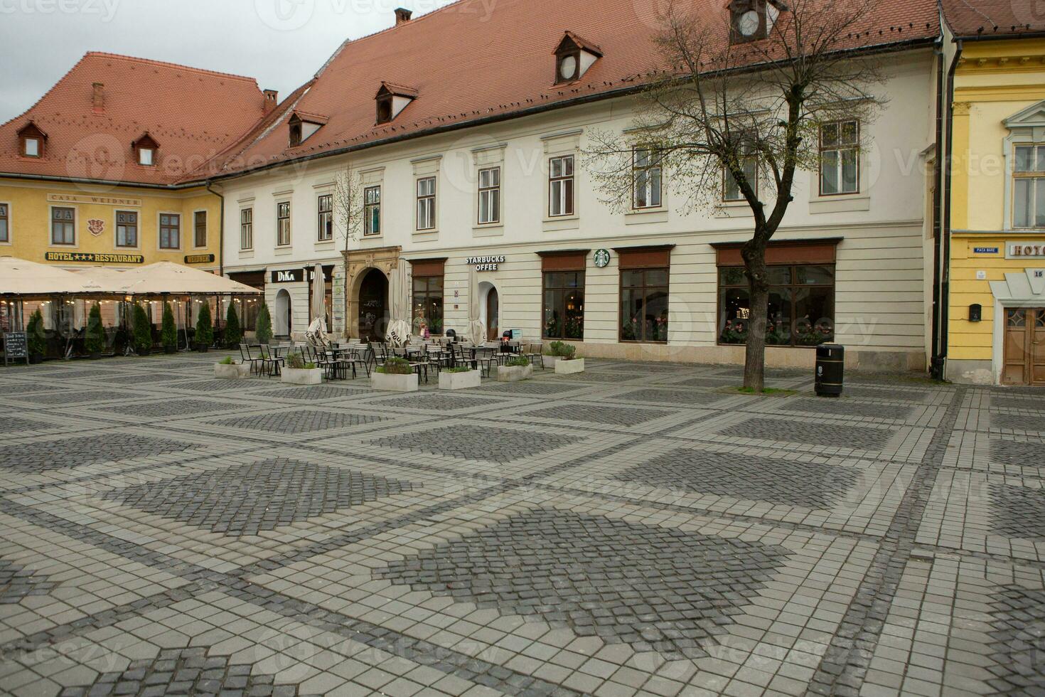 Medieval street with historical buildings in the heart of Romania. Sibiu the eastern European citadel city. Travel in Europe photo