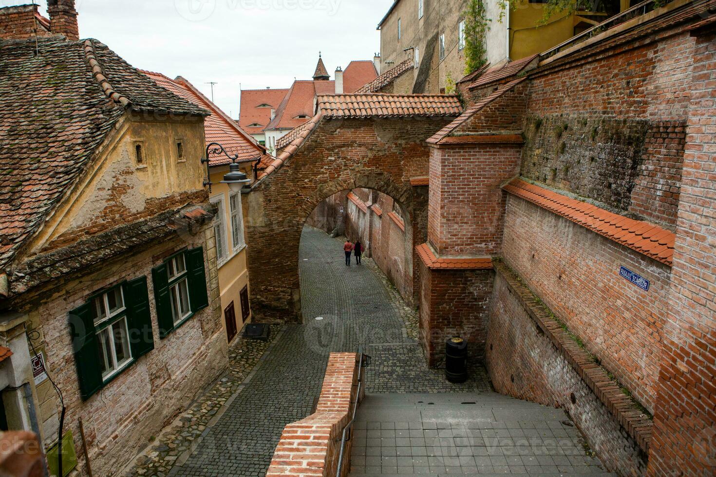 Medieval street with historical buildings in the heart of Romania. Sibiu the eastern European citadel city. Travel in Europe photo