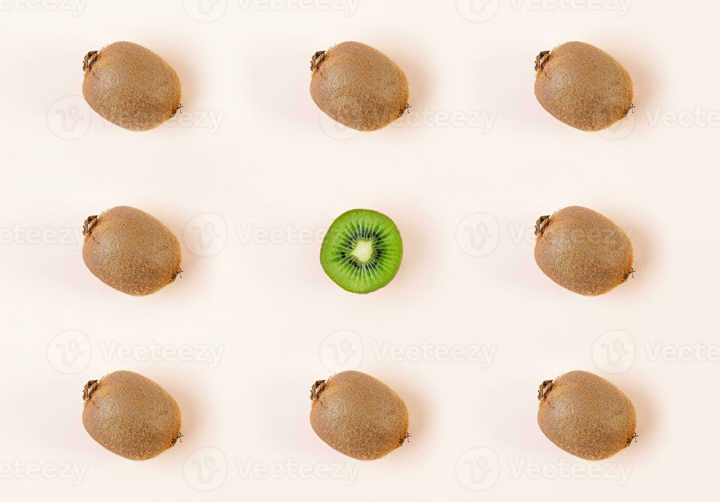 Kiwi fruit on wooden background. Pattern with juicy kiwifruit photo