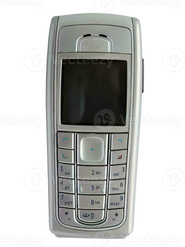 Old mobile phone isolated on white background with clipping path, early wireless digital technology, communication device photo