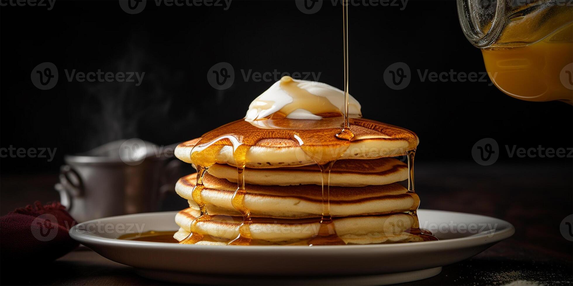 Homemade pancakes with butter and maple syrup on a plate, side view. Close-up. . photo