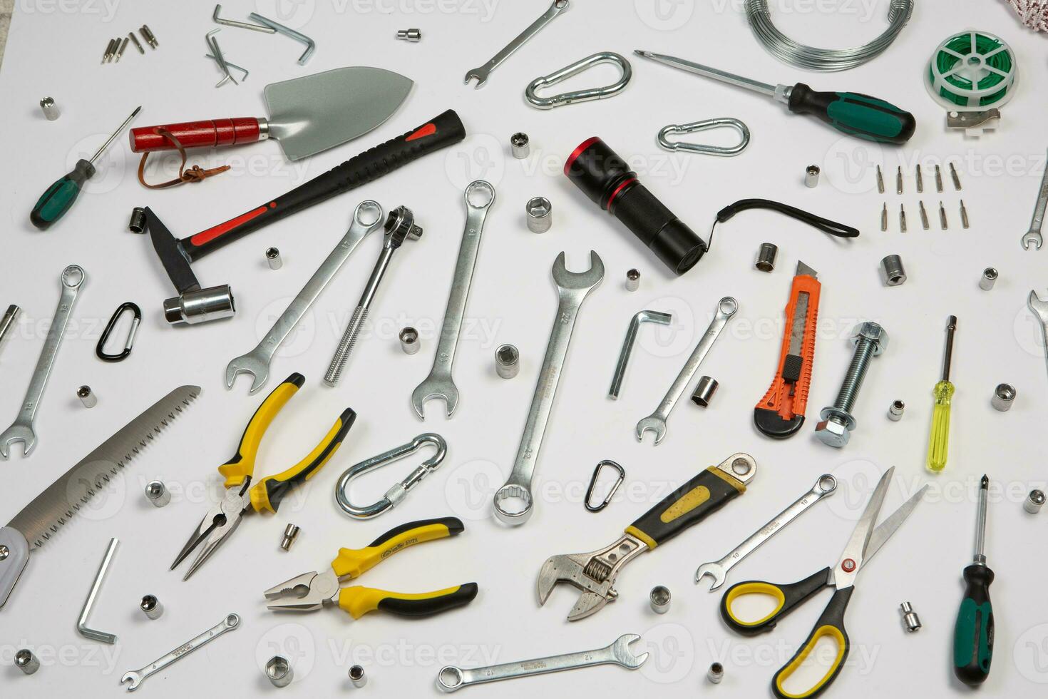 Set of tools for construction or the house. Wrench, pliers, hammer, screwdriver, flashlight, bold, scissors, knife and others. photo