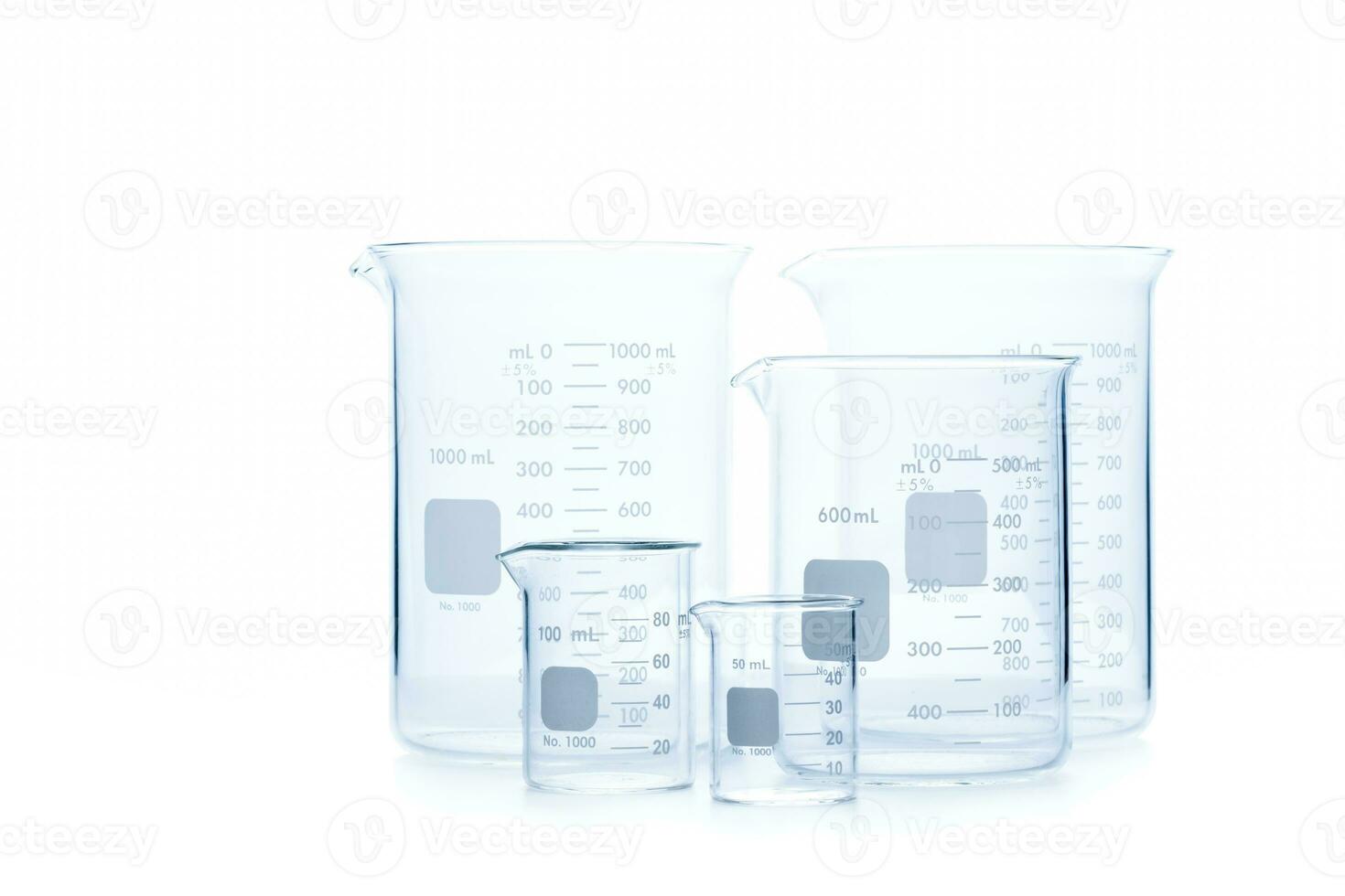 Mix size of measuring beakers for science experiment in laboratory isolated photo