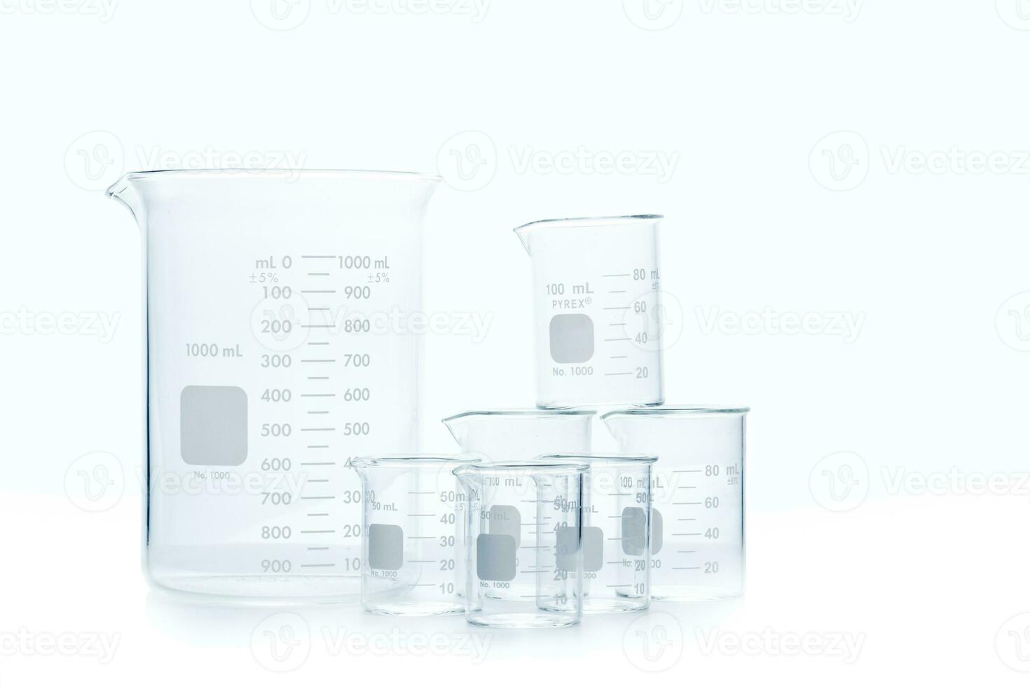Mix size of measuring beakers for science experiment in laboratory isolated photo