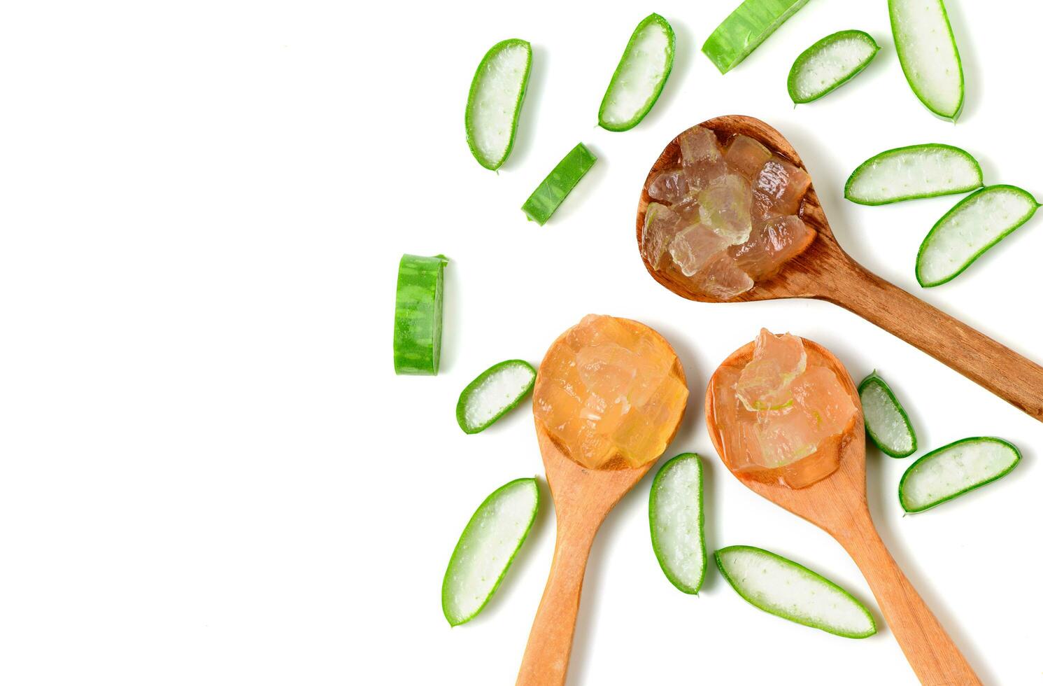 Fresh Slice Aloe Vera on wood spoon iaolated on white background photo