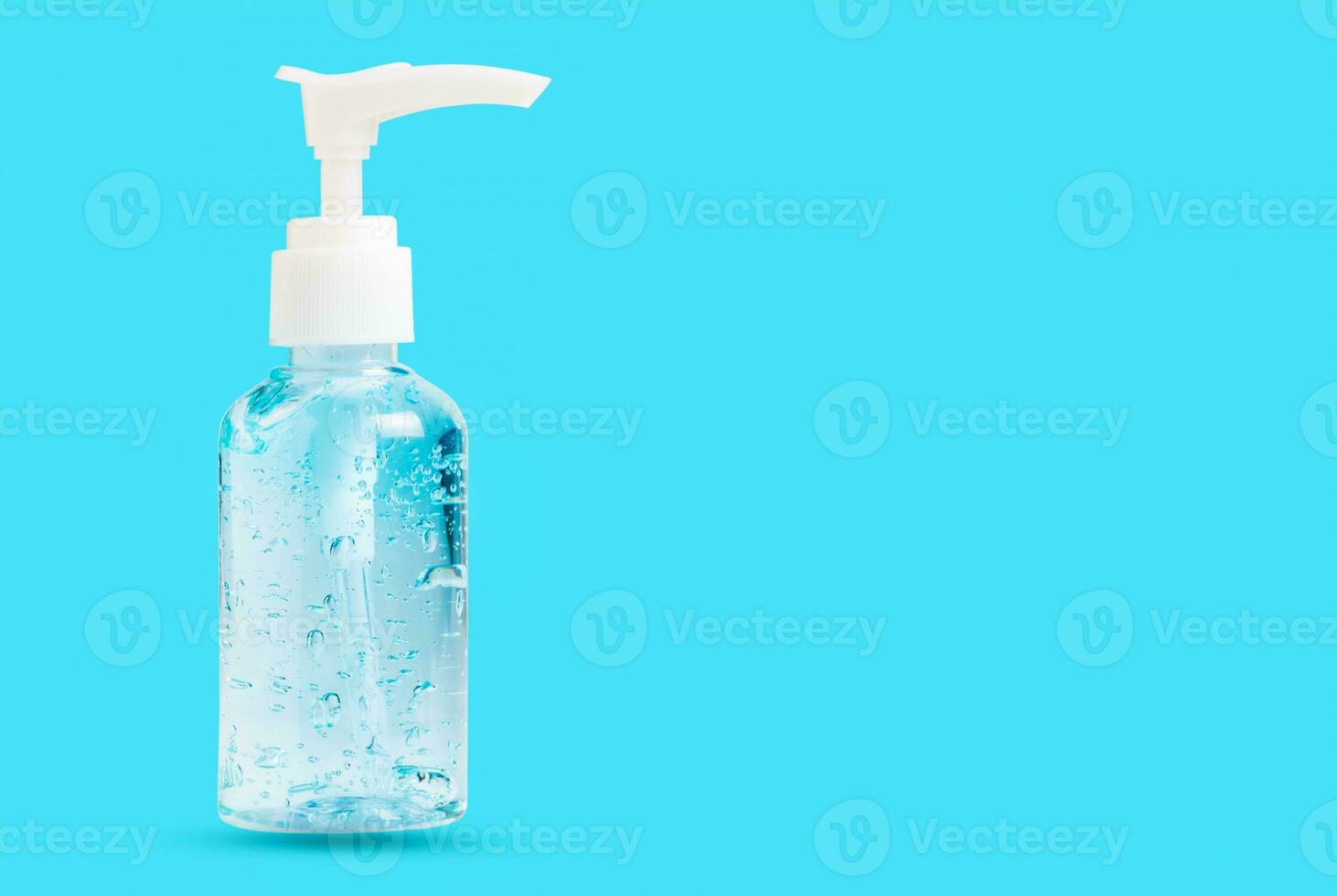 Hand sanitizer bottle or alcohol gel isolated on  blue background photo
