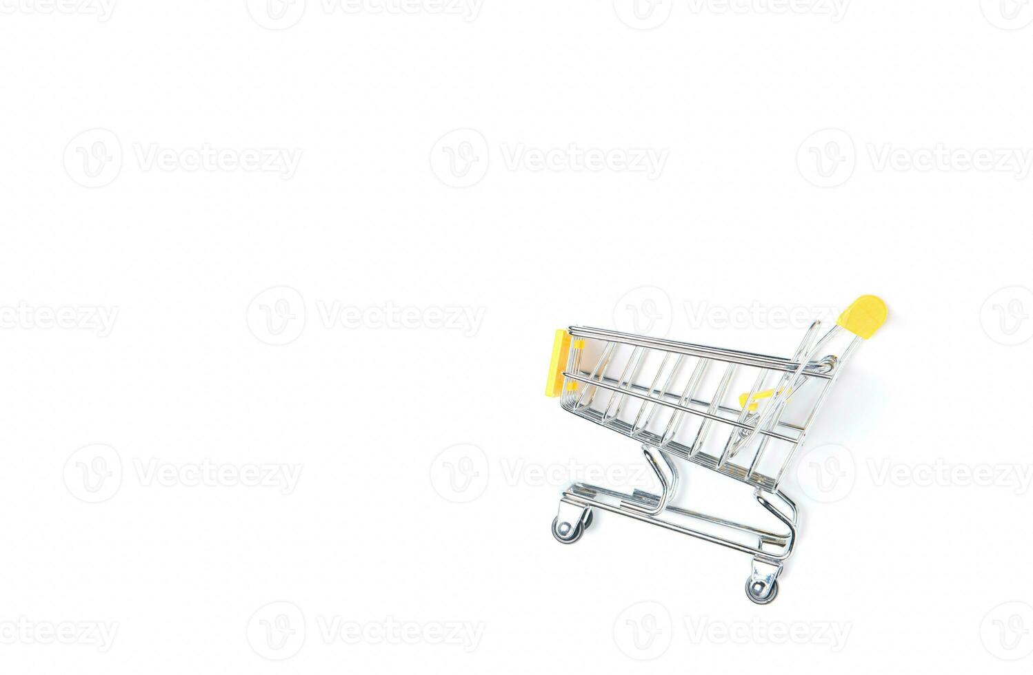 Empty shopping trolley isolated on white photo