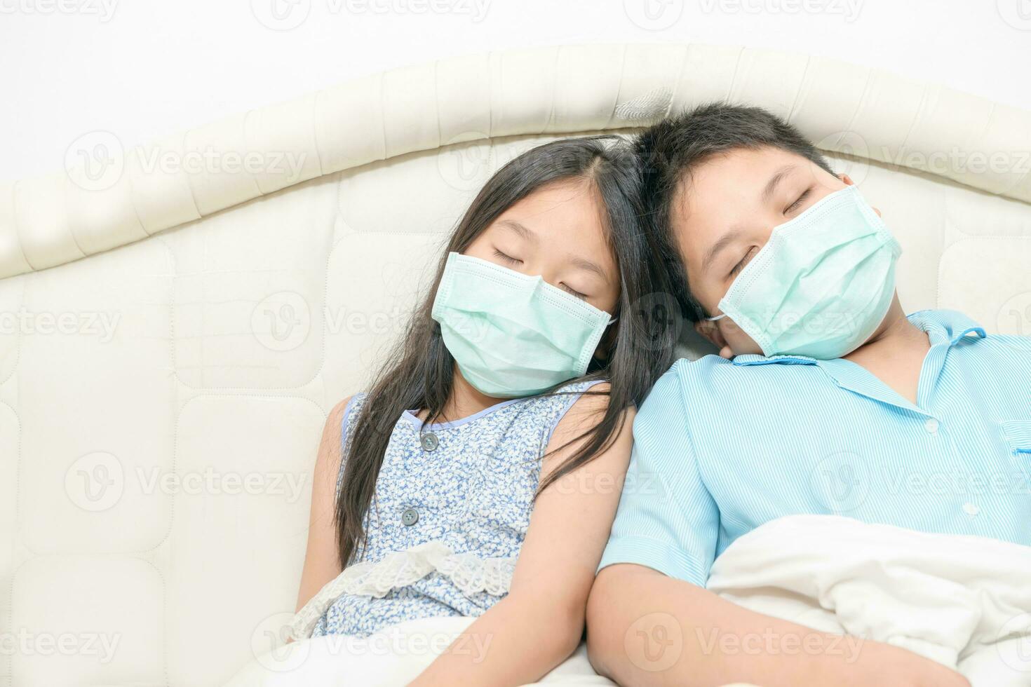 Brother and sister wear surgical mask sleep on bed, Sick child photo