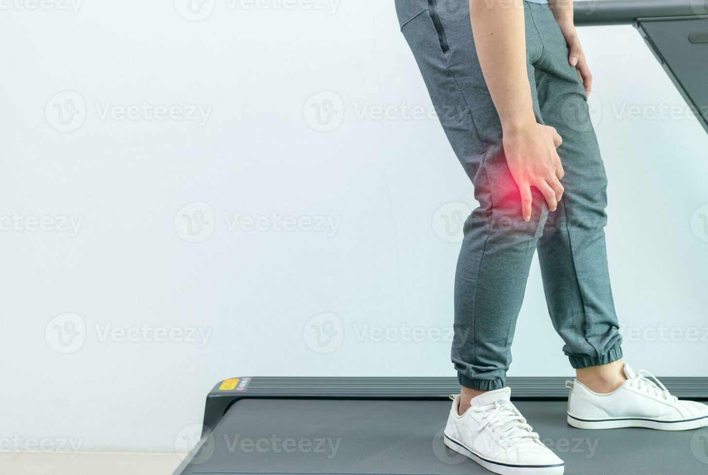 Close up young man suffer knee pain during run photo