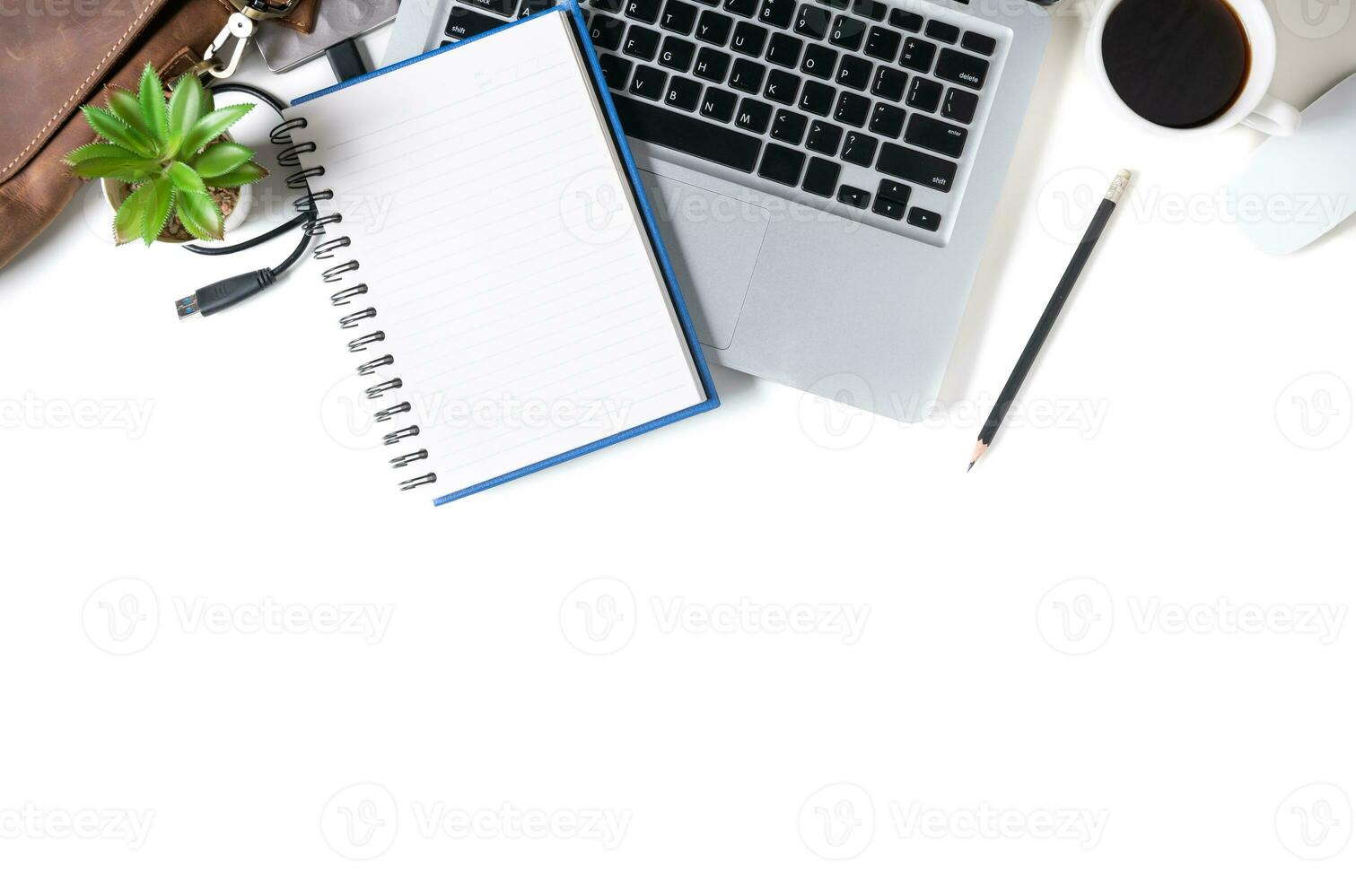 White office desk table Blank notebook with laptop computer, photo