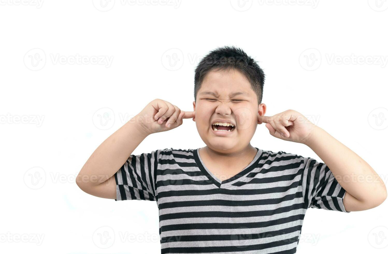Obese fat boy covering ears ignoring annoying loud noise isolated photo