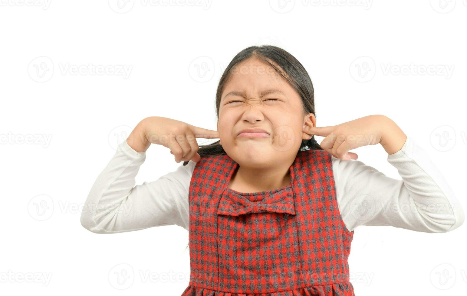 Girl covering ears ignoring annoying loud noise photo