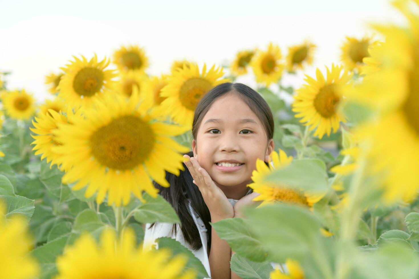 Happy cute asian girl smile with sunflower, photo