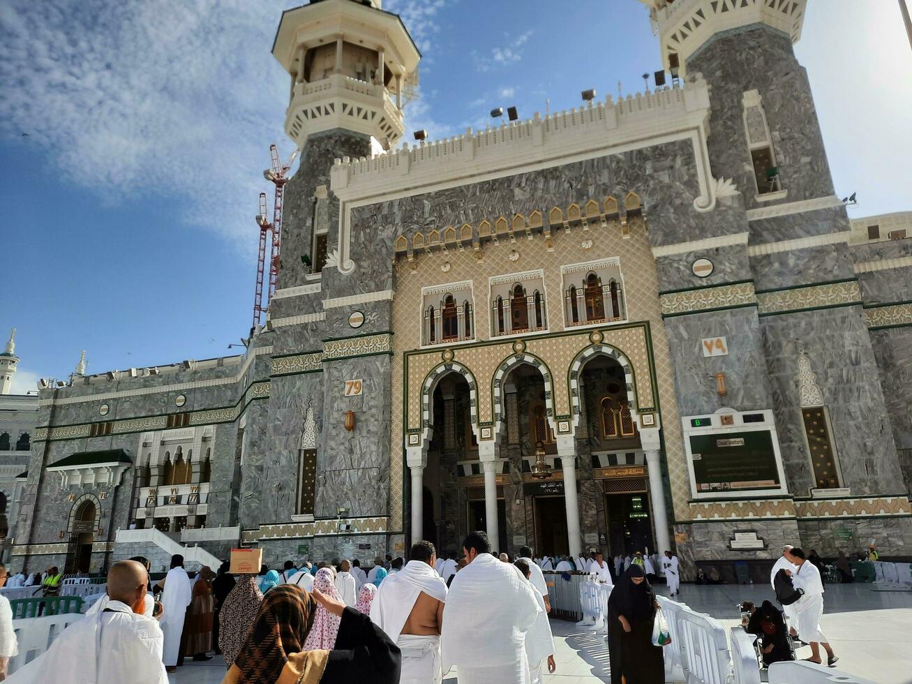 Mecca, Saudi Arabia, April 2023 - Pilgrims from different countries of the world enter Masjid al-Haram from Bab Fahd to perform Umrah at Masjid al-Haram, Mecca. photo