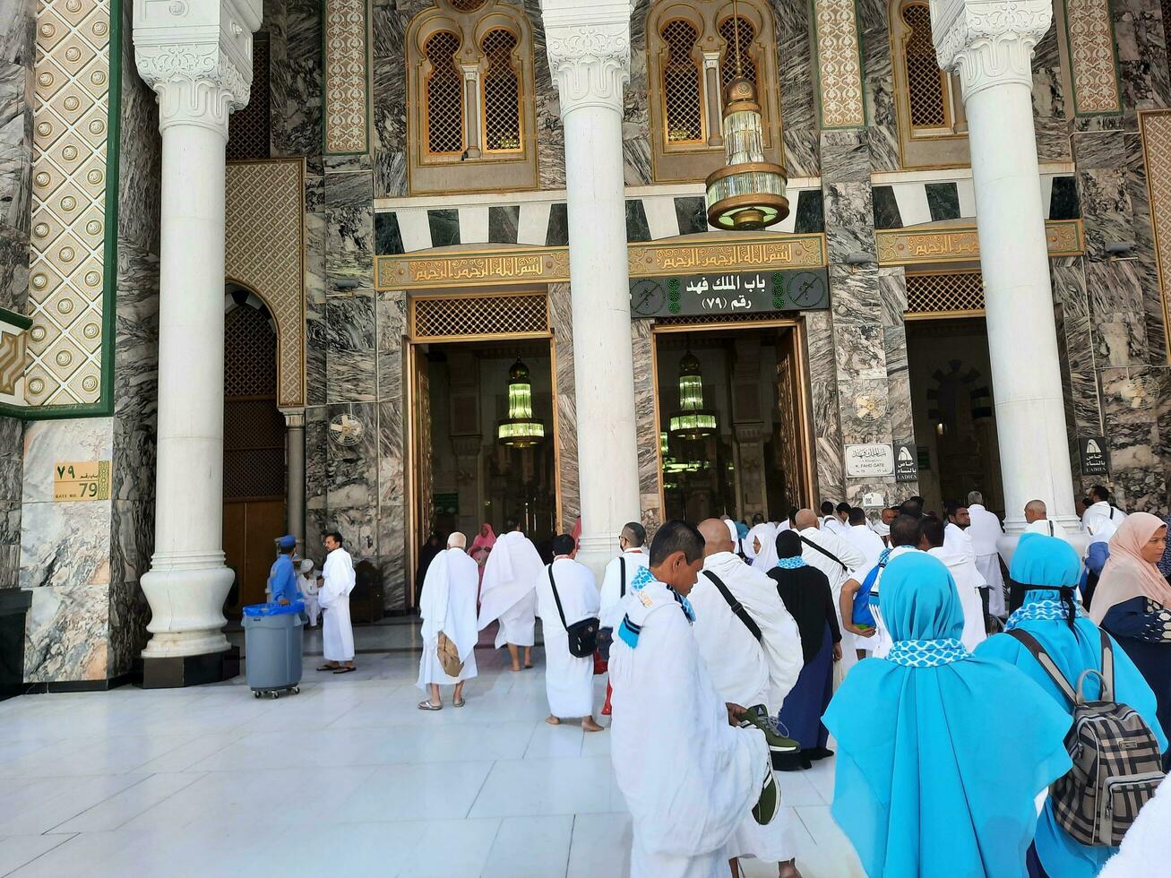 Mecca, Saudi Arabia, April 2023 - Pilgrims from different countries of the world enter Masjid al-Haram from Bab Fahd to perform Umrah at Masjid al-Haram, Mecca. photo