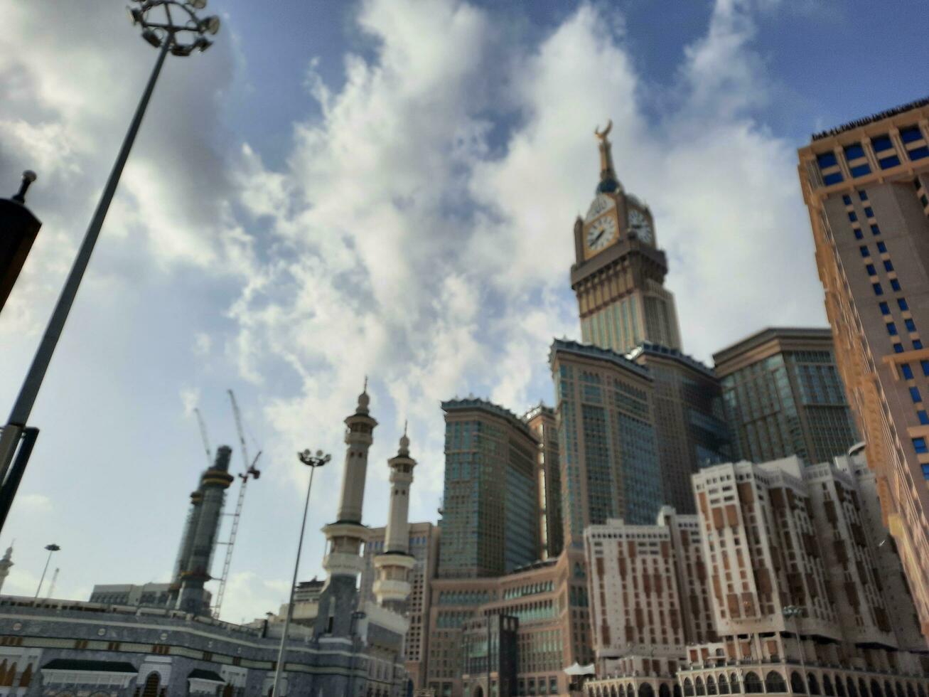 Mecca, Saudi Arabia, April 2023 - A beautiful daytime view of the Makkah Clock Tower from the courtyard of Masjid al-Haram, Mecca. photo