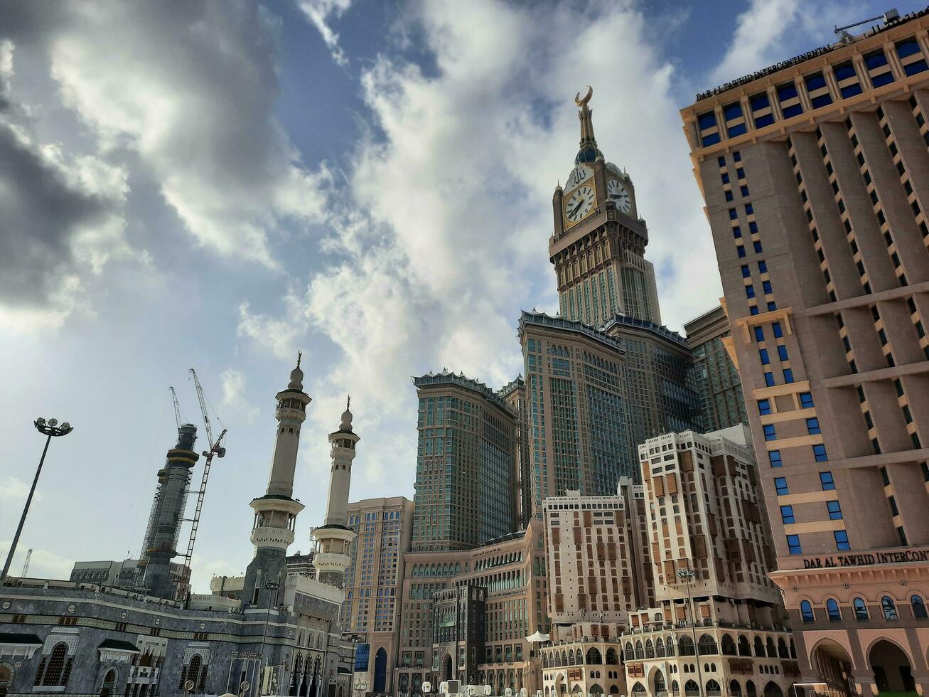 Mecca, Saudi Arabia, April 2023 - A beautiful daytime view of the Makkah Clock Tower from the courtyard of Masjid al-Haram, Mecca. photo