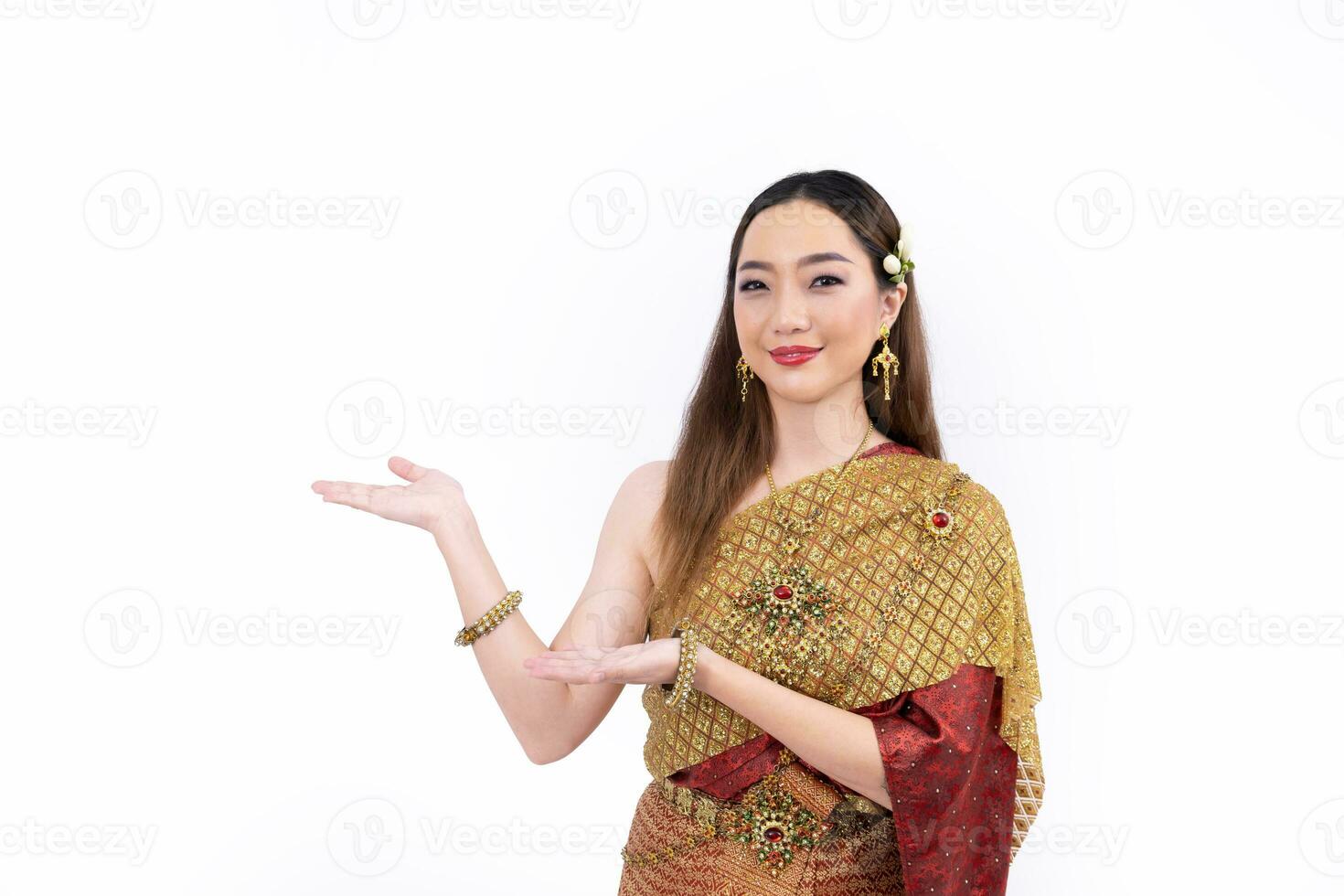 Thai woman in elegant wealthy  traditional dress doing hand presenting gesture for promoting culture in Thailand isolated on white background photo