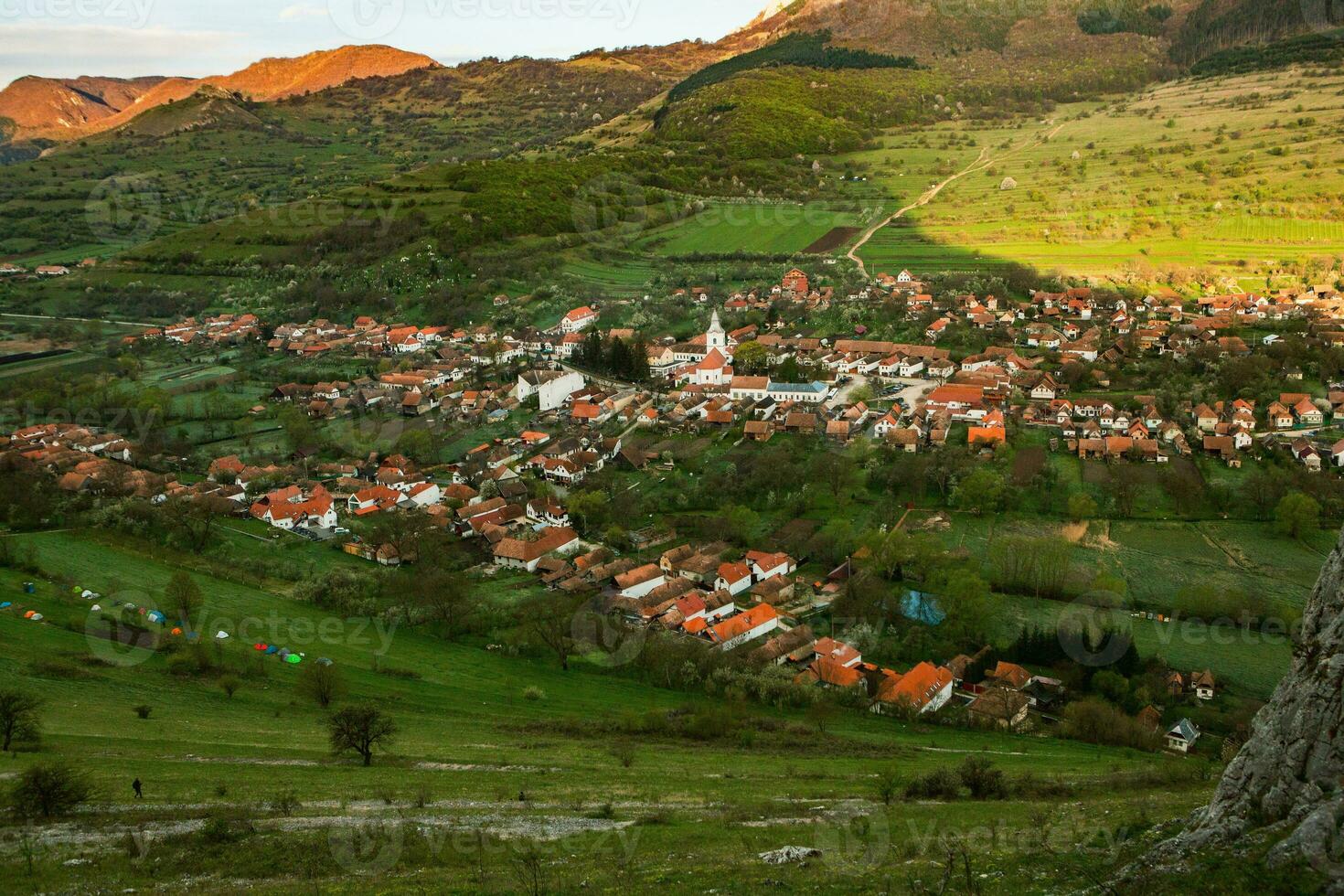 Rimetea is a small village located in Transylvania, Romania. It is situated in the Apuseni Mountains and is known for its picturesque setting and well preserved Hungarian architectural style. photo