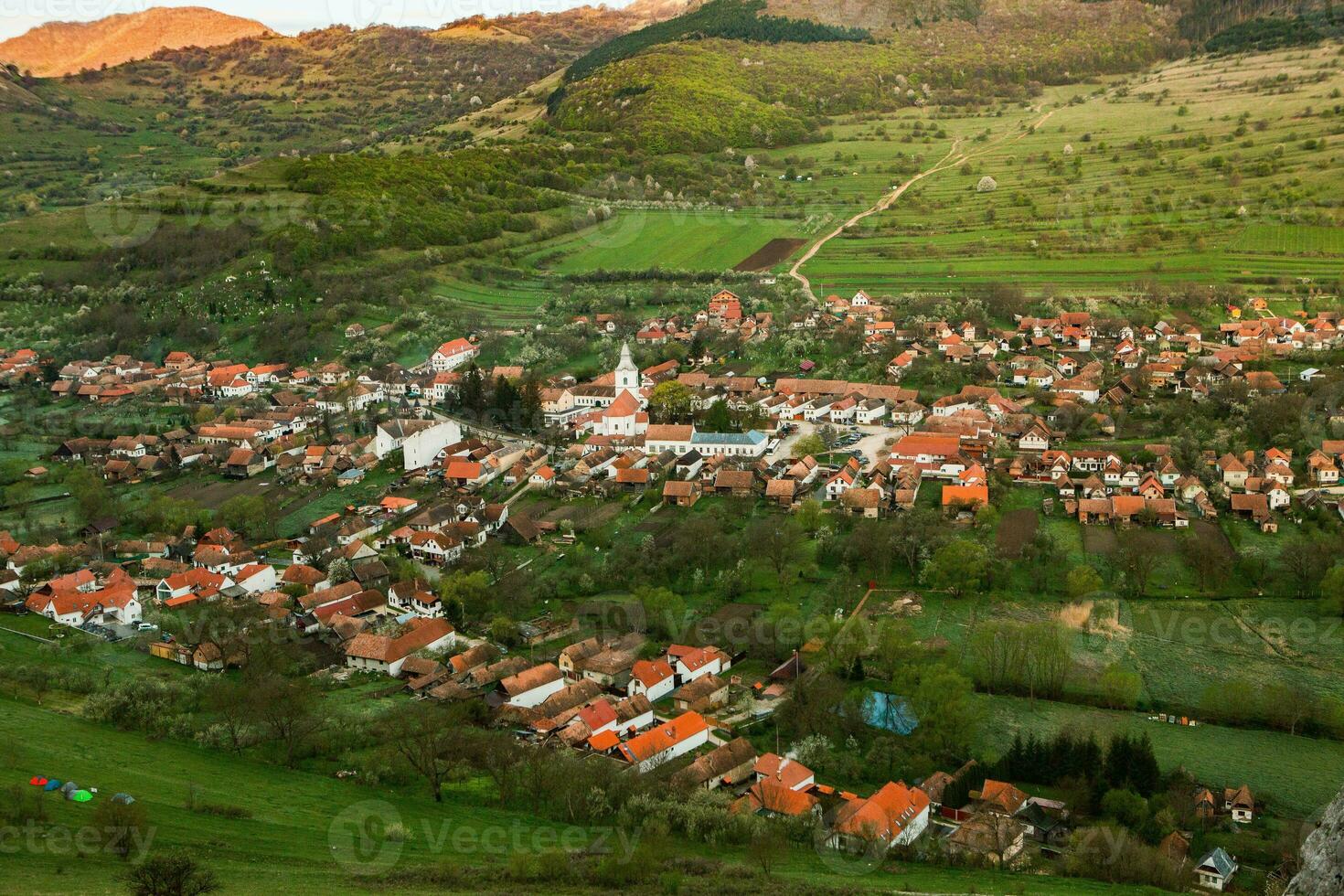 Rimetea is a small village located in Transylvania, Romania. It is situated in the Apuseni Mountains and is known for its picturesque setting and well preserved Hungarian architectural style. photo
