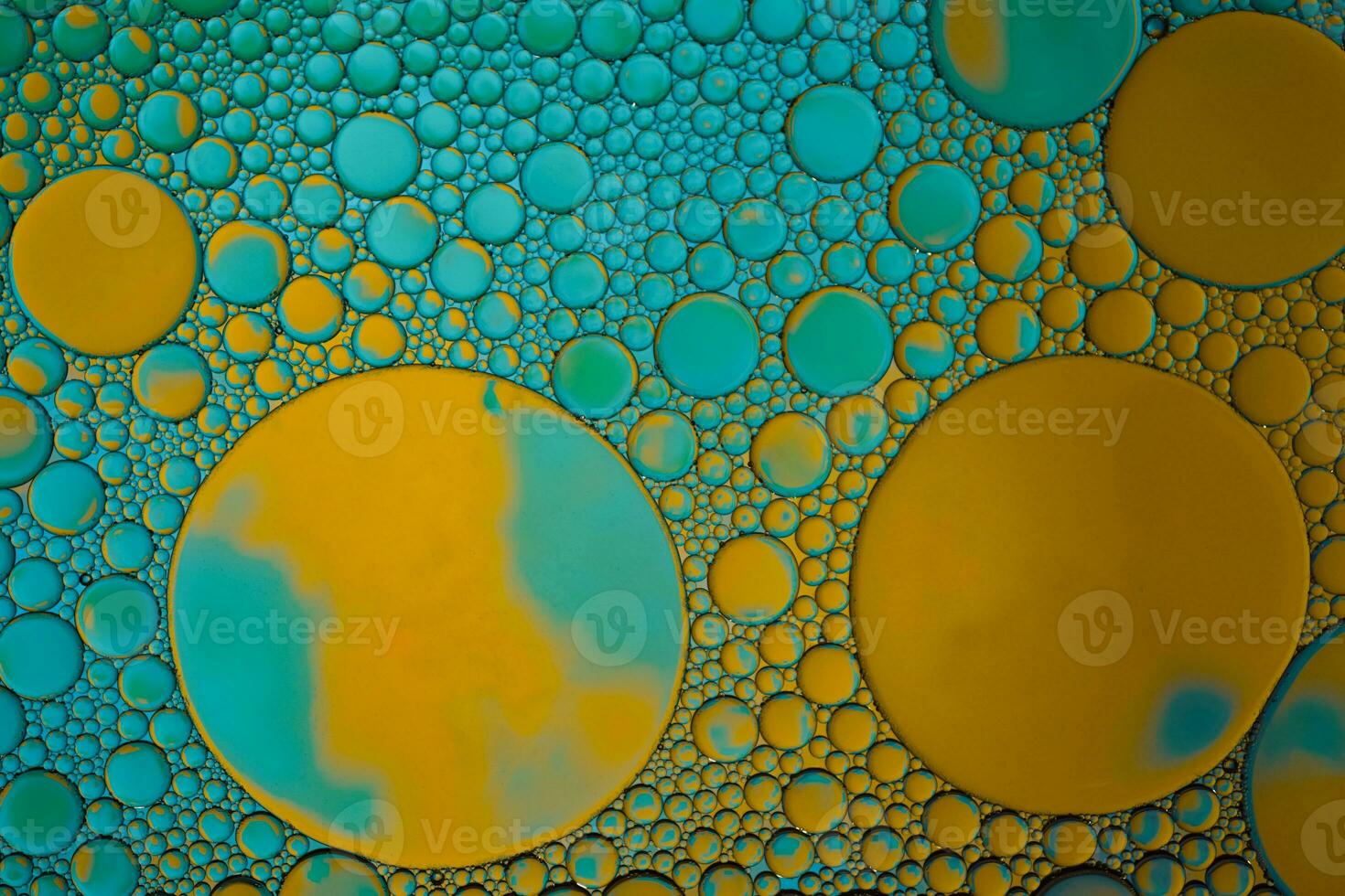 multi colored oil circles on the water, colorful background photo