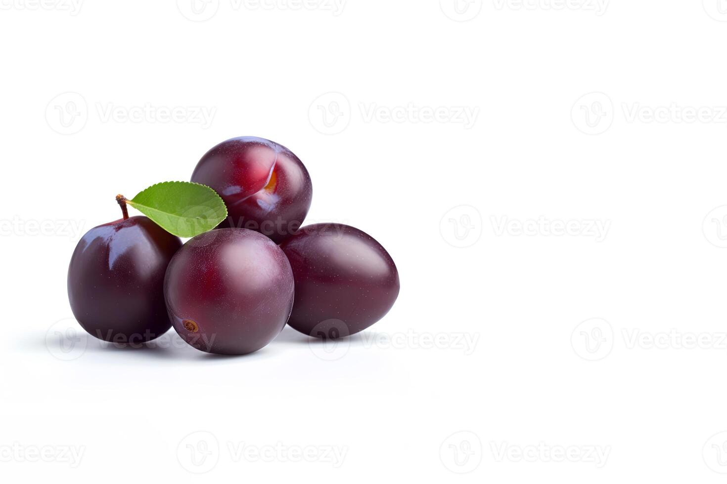 Fresh ripe plums with leaves isolated on white background with copy space. photo