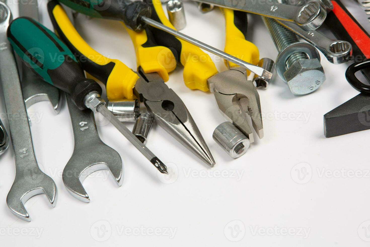 Set of tools for repair in a case on a white background. Assorted work or construction tools. Wrenches, Pliers, screwdriver. Top view photo