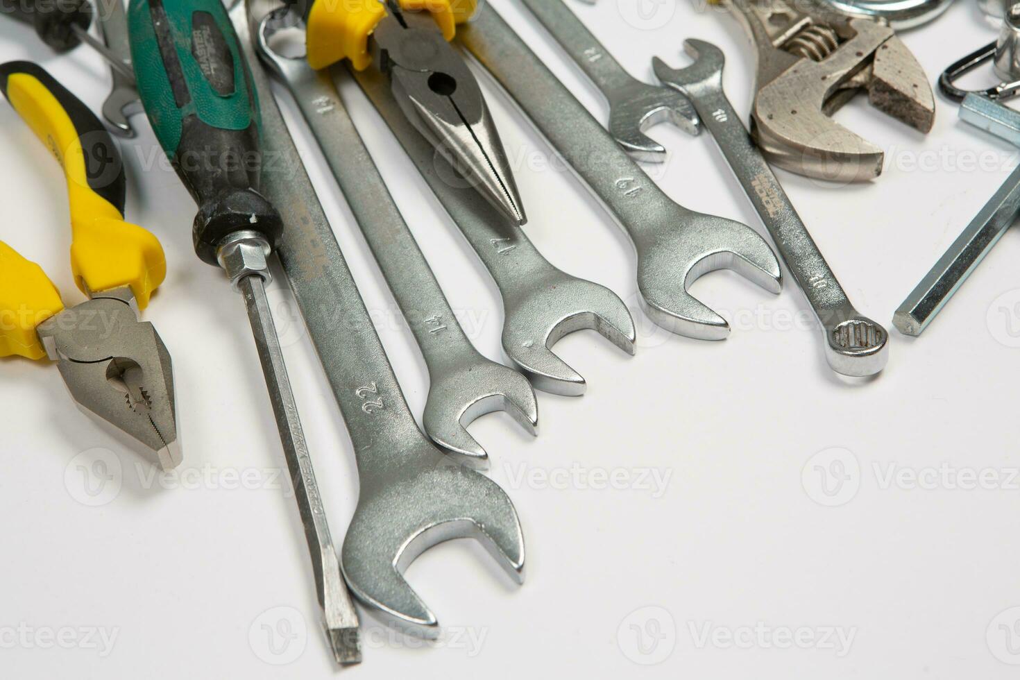 Set of tools for repair in a case on a white background. Assorted work or construction tools. Wrenches, Pliers, screwdriver. Top view photo