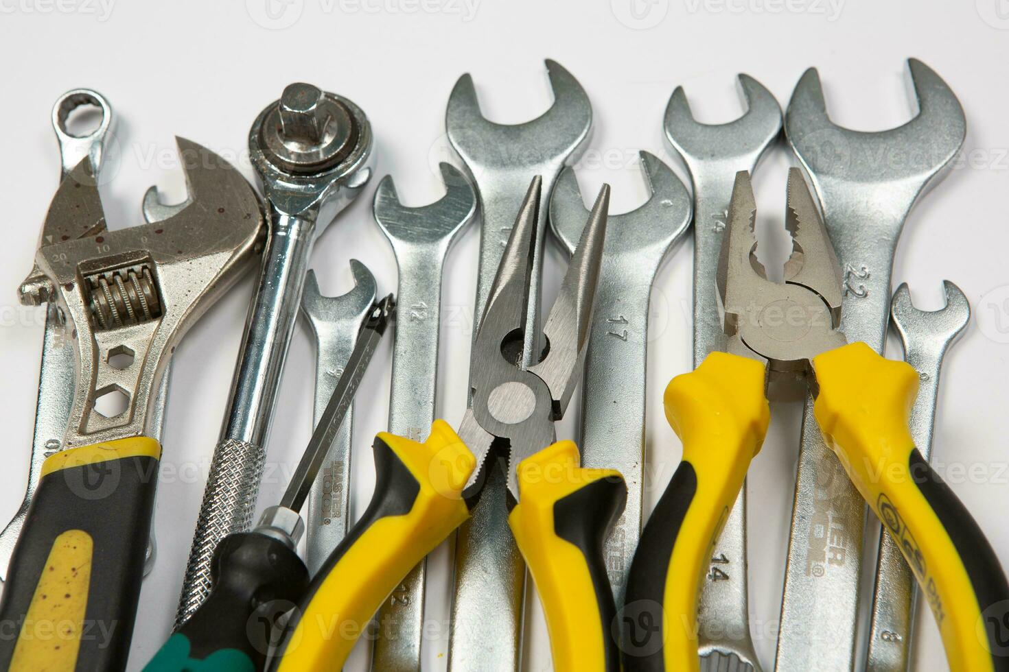 Set of tools for repair in a case on a white background. Assorted work or construction tools. Wrenches, Pliers, screwdriver. Top view photo