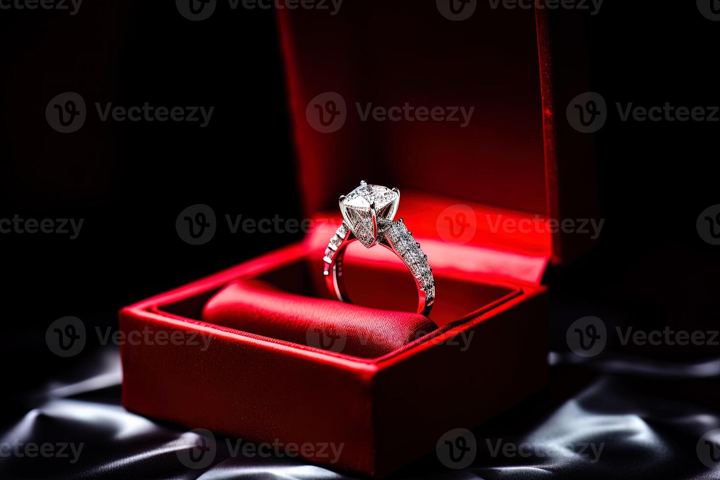 elegant diamond wedding ring in a box with a red theme. photo