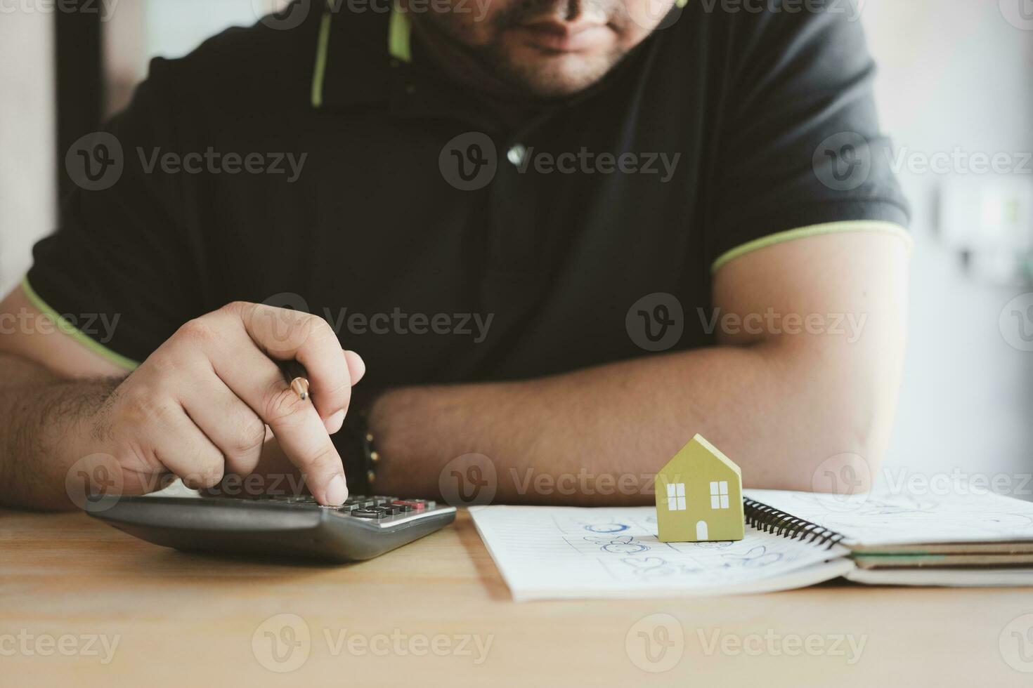 Man use calculator to calculate interest rate,real estate business