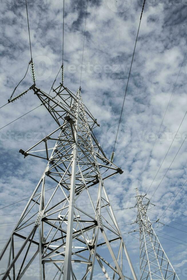 High-voltage power lines at sunset. Electricity distribution station.  electricity pylons on the background of the sky photo