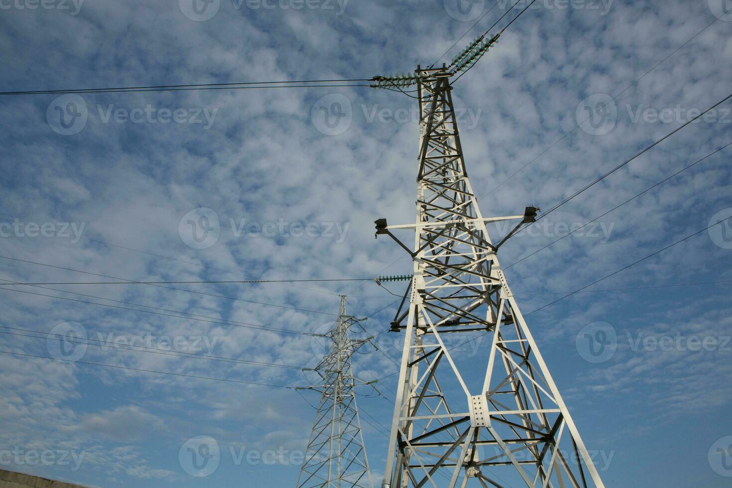 High-voltage power lines at sunset. Electricity distribution station.  electricity pylons on the background of the sky photo