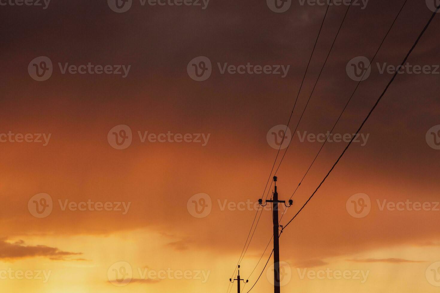 High-voltage power lines at sunset. Electricity distribution station.  electricity pylons on the background of the sky photo