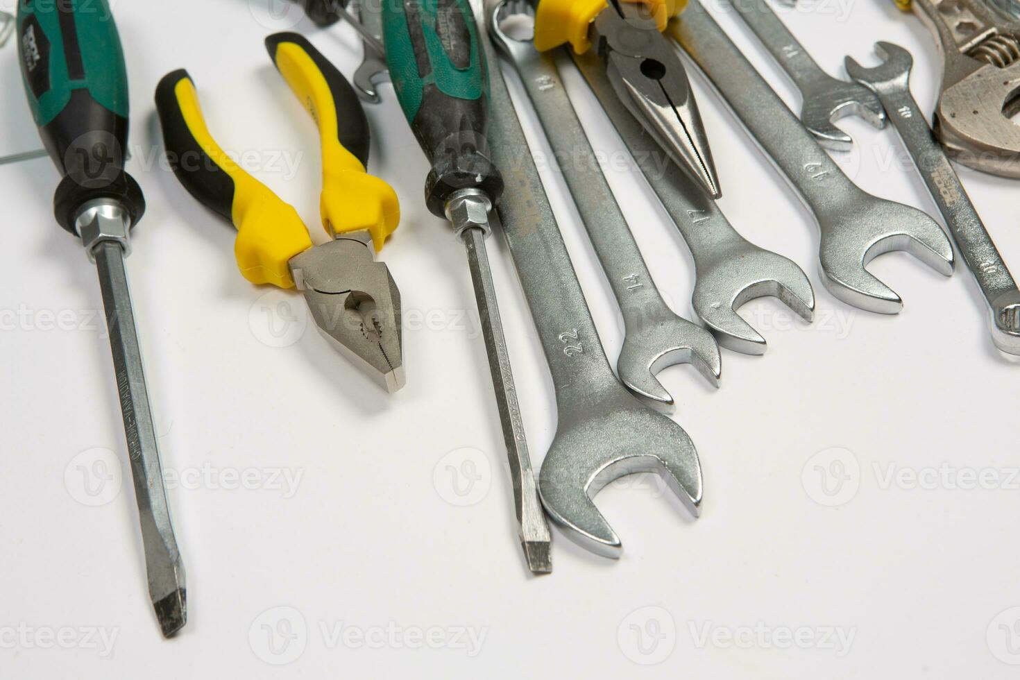 Set of tools for repair in a case on a white background. Assorted work or construction tools. Wrenches, Pliers, screwdriver. Top view photo