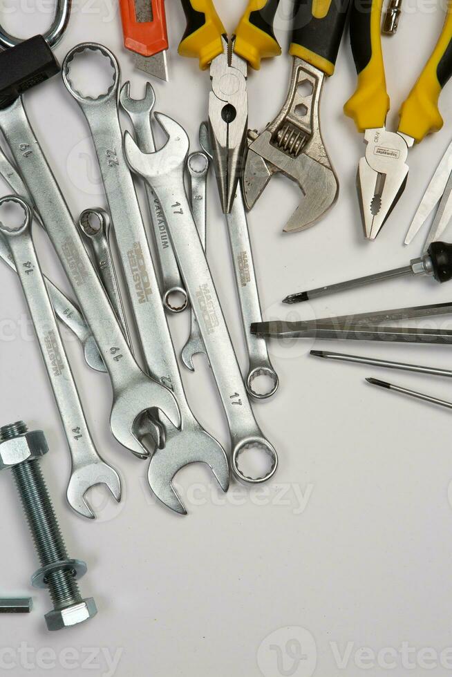 Set of tools for repair in a case on a white background. Assorted work or construction tools. Wrenches, Pliers, screwdriver. Top view photo