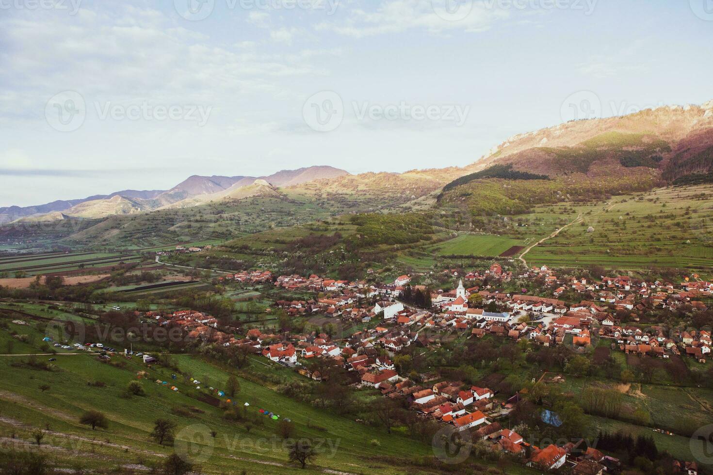 Rimetea is a small village located in Transylvania, Romania. It is situated in the Apuseni Mountains and is known for its picturesque setting and well preserved Hungarian architectural style. photo