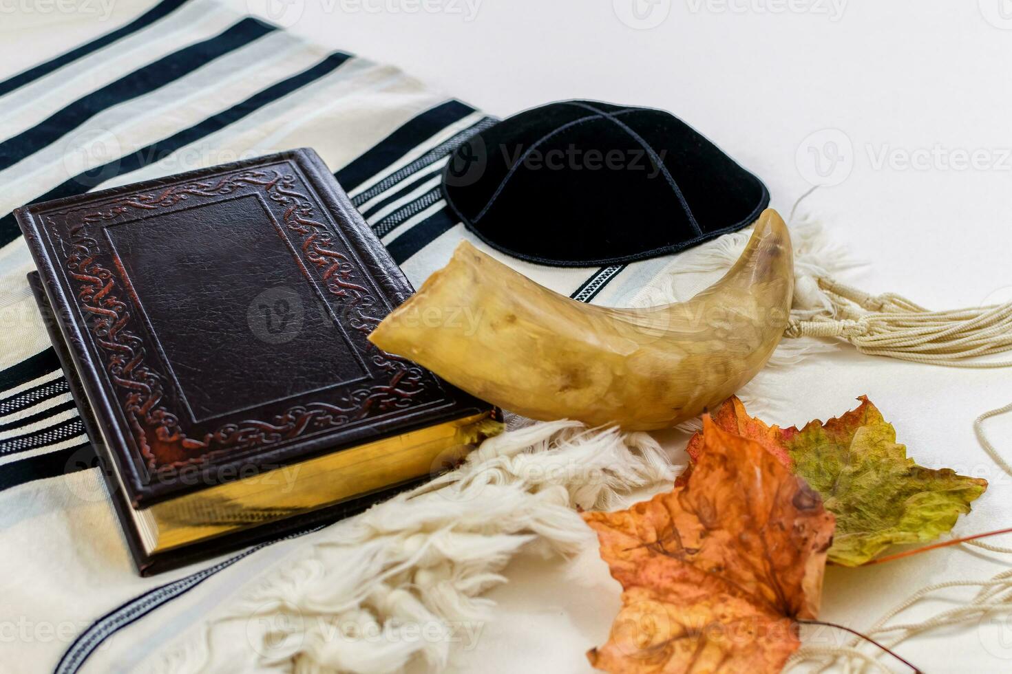 Prayer Shawl  Tallit, Prayer book and Shofar horn jewish religious symbols. Rosh hashanah jewish New Year holiday, Yom kippur concept. photo