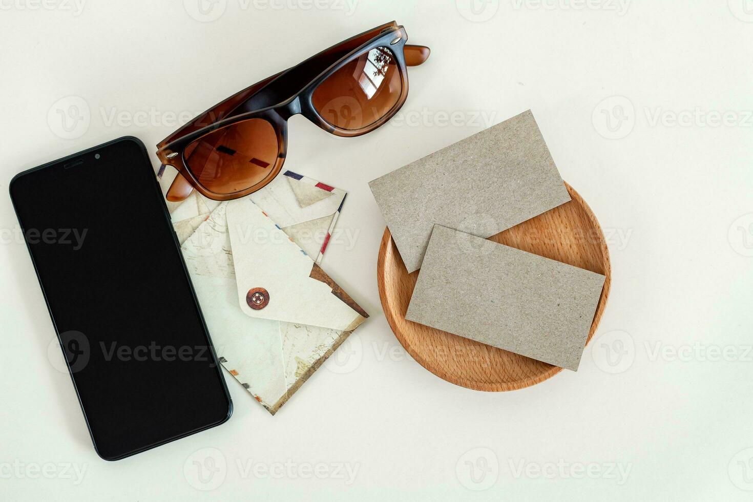 Home office desk. Creative workspace with business card, smart phone. Mock up. photo