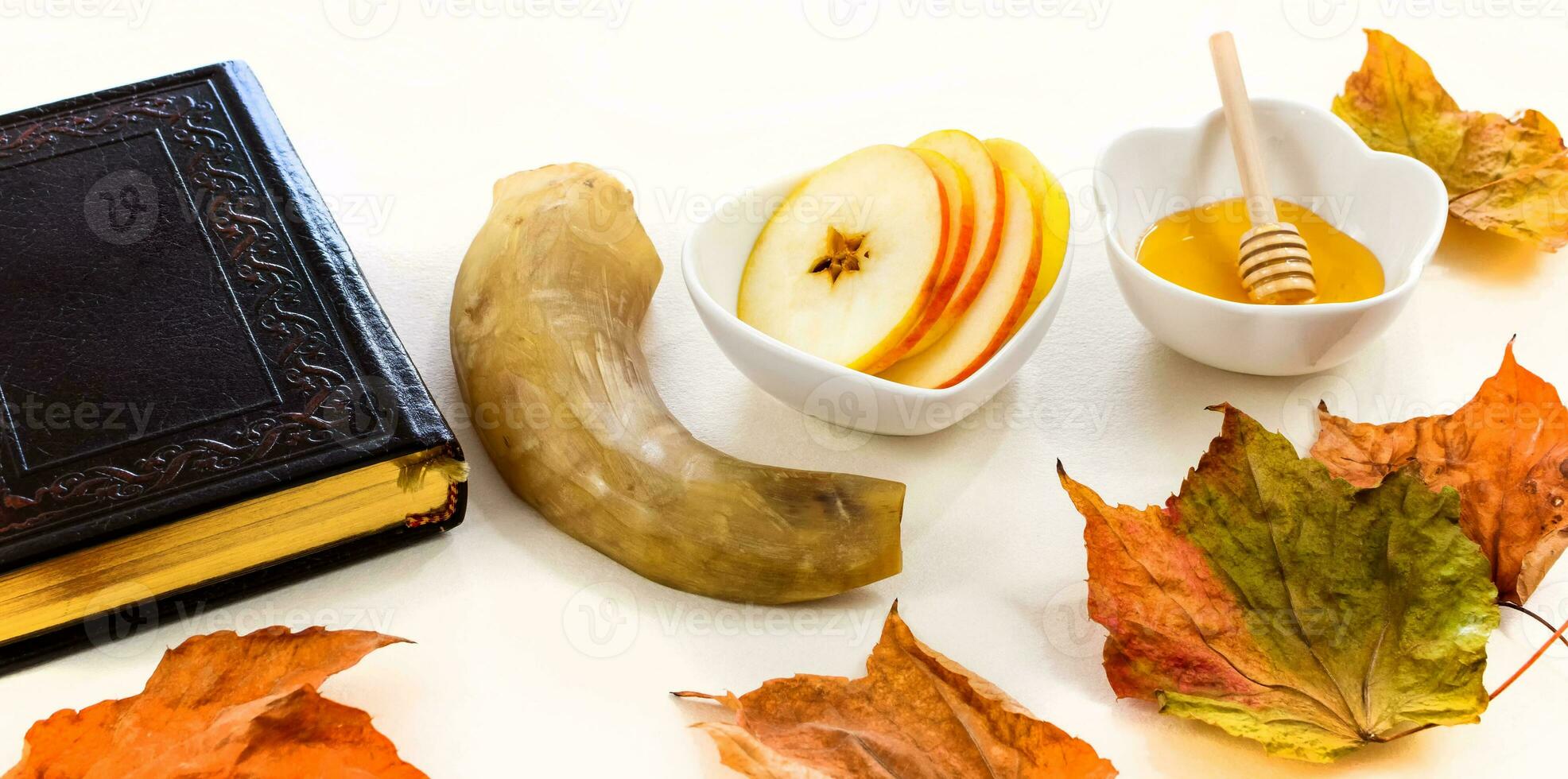 Rosh hashanah jewish New Year holiday concept  prayer book, apple, honey, shofar horn. Traditional symbols. photo