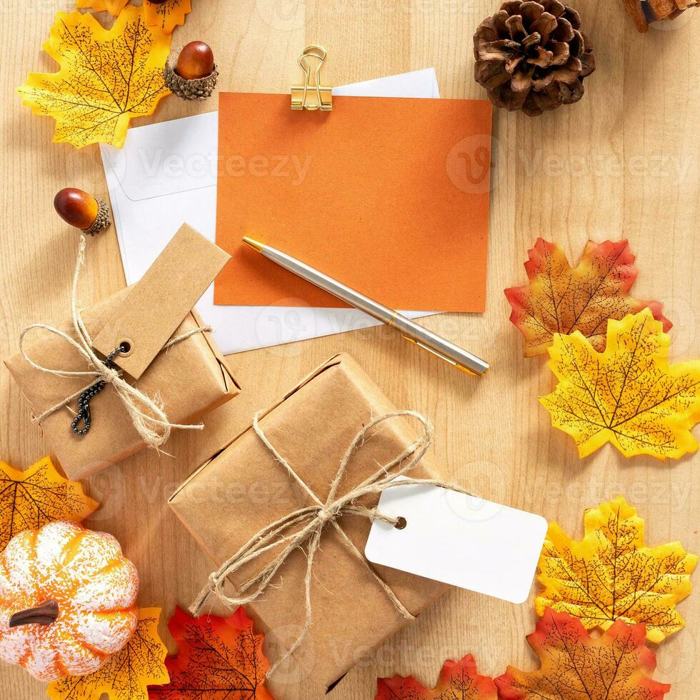 Composite image of happy thanksgiving with gifts, greeting and pen. photo