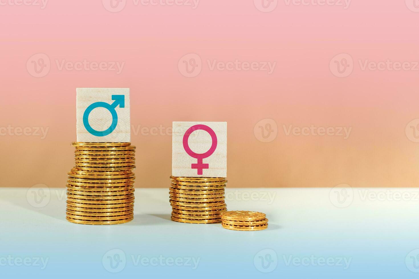 Male and female symbols on piles of coins. Gender pay equality concept. photo