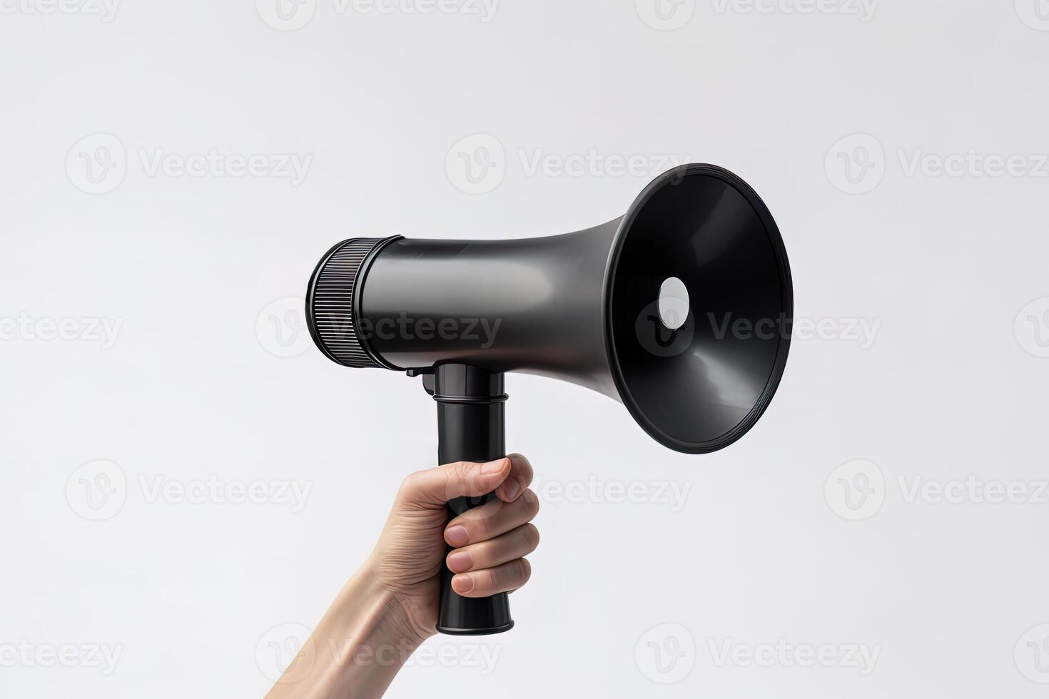 The hand holds a black megaphone on white background. Announcement concept. Shout It Out. photo