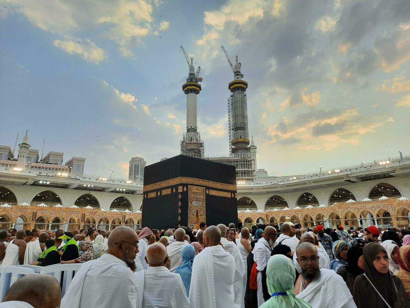 Mecca, Saudi Arabia, June 2023 - Pilgrims from different countries around the world perform Tawaf in the courtyard of Masjid Al Haram, Mecca in the evening. photo