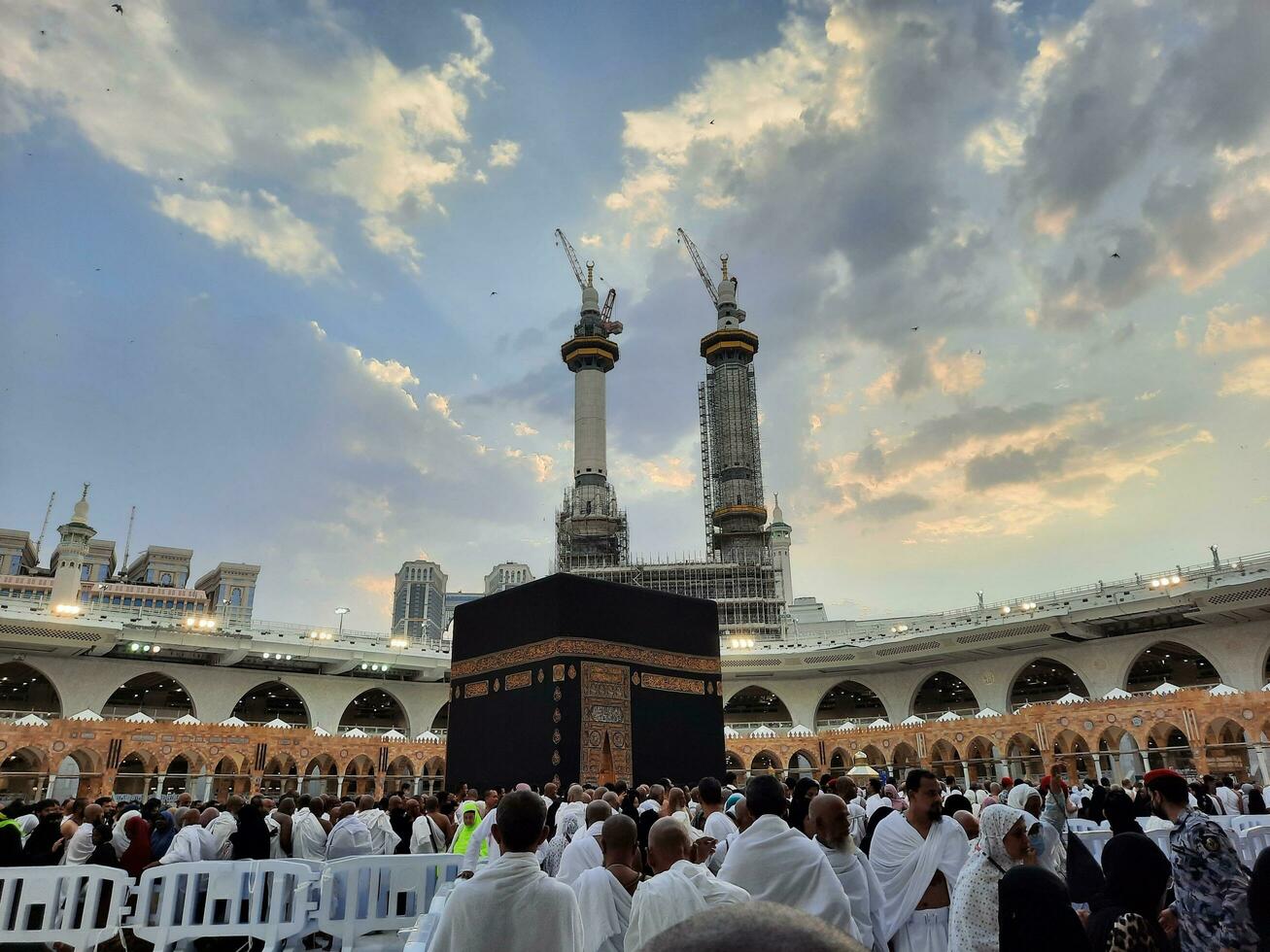Mecca, Saudi Arabia, June 2023 - Pilgrims from different countries around the world perform Tawaf in the courtyard of Masjid Al Haram, Mecca in the evening. photo