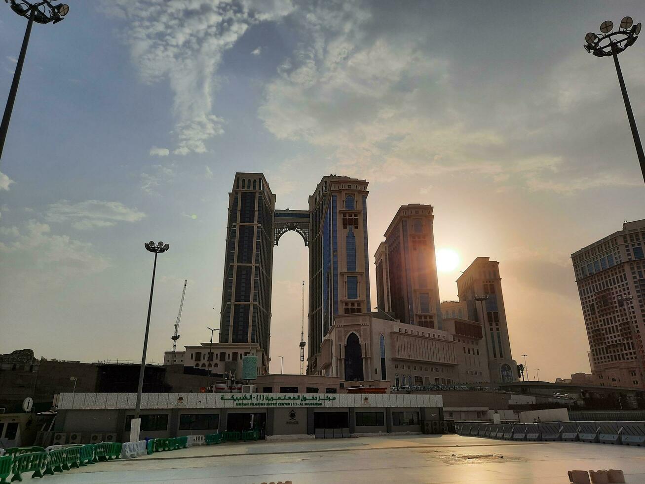 Mecca, Saudi Arabia, June 2023 - A beautiful view of the sunset behind the Jabal Omar residential complex in front of Masjid Al Haram in Mecca. photo