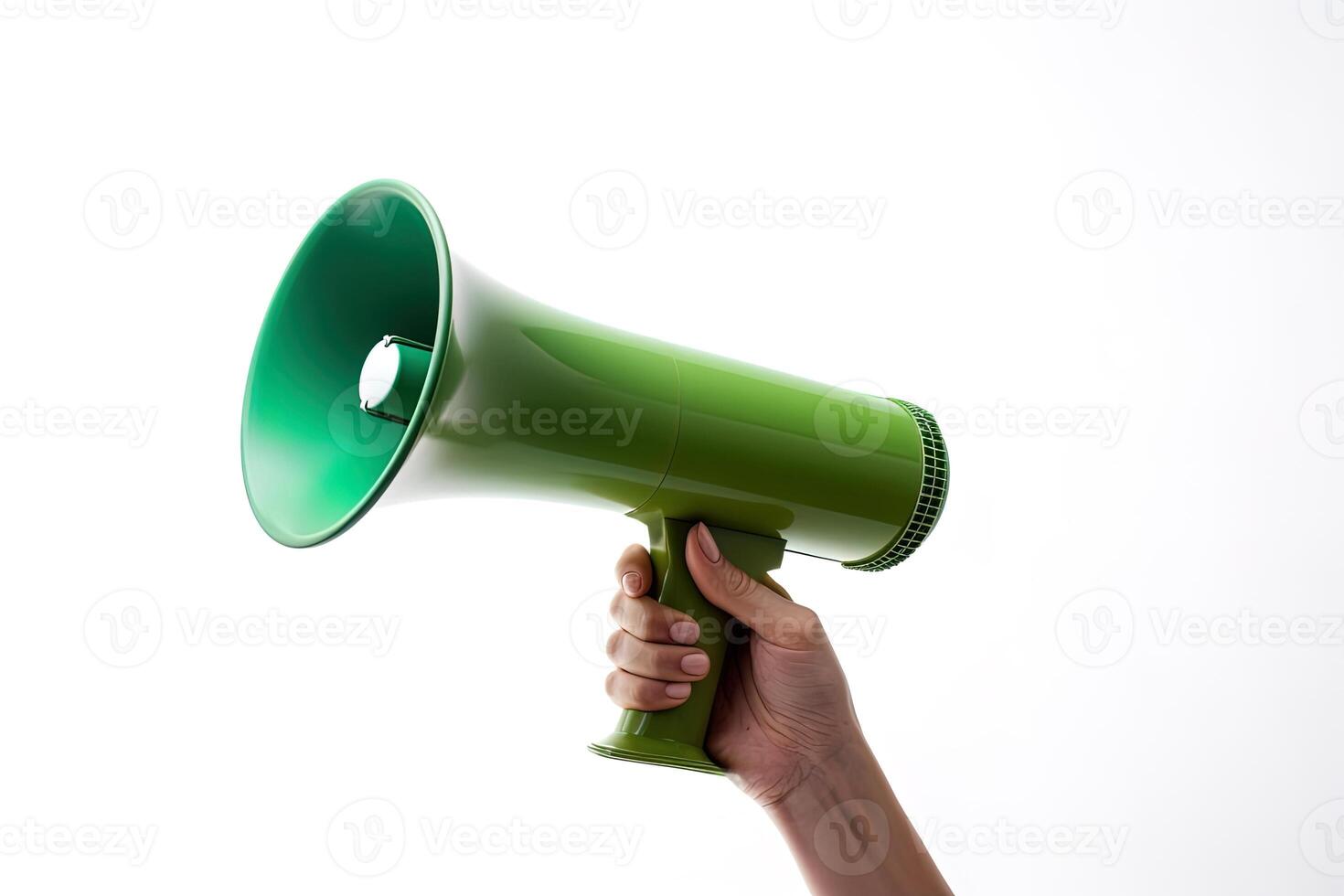 The hand holds a blue megaphone on a green background. Announcement concept. Shout It Out. photo